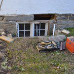 Loose stone foundation above old window.